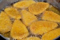 Frying classic breaded chicken pane cuisine in deep oil background, selective focus of chicken pane, tenders, fillet or goujons