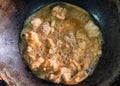 Frying crispy fried chicken meat with boiling oil in fry pan on gas stove Royalty Free Stock Photo