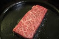 Frying delicious Wagyu in cast iron pan Royalty Free Stock Photo