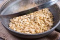 Frying egg with oatmeal in a frying pan. Healthy breakfast, healthy eating, vegan food concept. Royalty Free Stock Photo