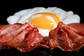 Frying egg and two bacon rashers Royalty Free Stock Photo