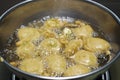 FRYING INDIAN SUBCONTINENT FOOD NAMED PAKORA ALOO BHAJIYA
