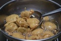 FRYING INDIAN SUBCONTINENT FOOD PAKORA ALOO BHAJIYA with spoon