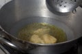 Frying pakode in pan with oil, very popular street food in India.famous indian food, Selective focus on subject Royalty Free Stock Photo