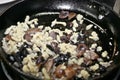 Frying pan on cooker with mushrooms with rice Royalty Free Stock Photo