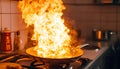 Frying pan with flames leaping from it in a dramatic kitchen accident showcasing fire hazard Royalty Free Stock Photo