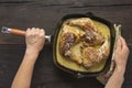 Frying pan with fried legs in female hands Royalty Free Stock Photo