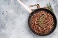 Frying Pan with fried mince beef meat, fresh cooked forcemeat. grey background. top view Royalty Free Stock Photo