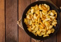 Frying pan with a fried potato in a rural way Royalty Free Stock Photo