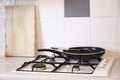 Frying pan on gas hob cooker in kitchen Royalty Free Stock Photo