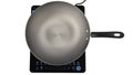 Frying pan on induction cooker Royalty Free Stock Photo