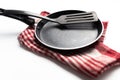 frying pan and kitchen spatula on white background Royalty Free Stock Photo