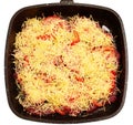 Frying pan with meat, tomatoes, grated cheese Royalty Free Stock Photo