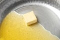 Frying pan with piece of melting butter Royalty Free Stock Photo