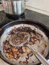 Frying pan with the remains of burnt scrambled eggs Royalty Free Stock Photo