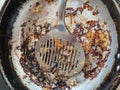 Frying pan with the remains of burnt scrambled eggs Royalty Free Stock Photo
