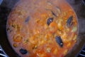 Frying pan with rice, seafood and vegetable close-up. Paella cooking. Mediterranian cuisine. Spanish traditional meal. Royalty Free Stock Photo