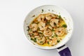 Frying pan with scampis in olive oil and herbs Royalty Free Stock Photo