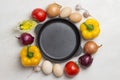 Frying pan. A set of vegetables for a healthy diet, yellow and red peppers, tomatoes, onions, garlic