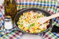 Frying pan with vegetable mix, oil and salt on towel Royalty Free Stock Photo