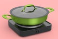 Frying pan or wok with glass lid on portable camping electric stove Royalty Free Stock Photo