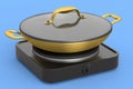 Frying pan or wok with glass lid on portable camping electric stove Royalty Free Stock Photo