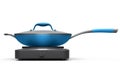 Frying pan or wok with glass lid on portable camping electric stove Royalty Free Stock Photo