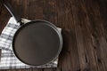 Frying pan on a wooden background Royalty Free Stock Photo
