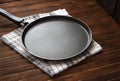 Frying pan on a wooden background Royalty Free Stock Photo