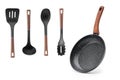 Frying pan wooden handle and a set of four blades, ladle isolate. Royalty Free Stock Photo