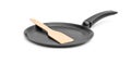 Frying pan with wooden spade on white background Royalty Free Stock Photo