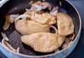 Frying pirogi on a stove top