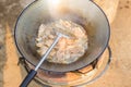 Frying pork on pot with boiling oil.delicious food, pork graves Royalty Free Stock Photo