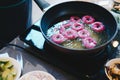 Frying purple sweet potato doughnut. deep fried dessert Royalty Free Stock Photo