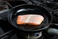 Frying salmon in pan