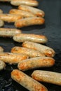 Frying sausages