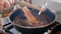 frying SUPER CRISPY PORK BELLY ( panceta a pururuca ) , pouring boiling iol, making crackling panceta