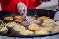 Frying traditional blini, blin or bulviniai blynai, potato pancakes Royalty Free Stock Photo