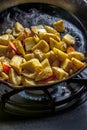 Frying up potatoes in a skillet. Royalty Free Stock Photo