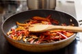 Frying vegetables in a pan