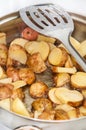 Frying young potatoes in deep hot oil Royalty Free Stock Photo