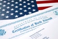 Fs-545 Certification of birth abroad lies on United States flag with envelope from Department of Homeland Security Royalty Free Stock Photo