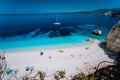 Fteri beach, Cephalonia Kefalonia, Greece. White catamaran yacht in clear deep blue sea water with amazing dark pattern Royalty Free Stock Photo