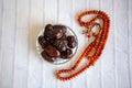 Fthar Food evening meal Ramadan kareem,Concept: Date of Islamic fasting,fruit date placed on a white background rosary