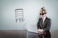 FTP text with vintage businessman using laptop