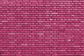 Fuchsia rose colored brick wall background