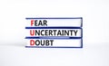 FUD fear uncertainty doubt symbol. Concept words FUD fear uncertainty doubt on books on a beautiful white table white background. Royalty Free Stock Photo