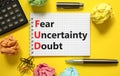 FUD fear uncertainty doubt symbol. Concept words FUD fear uncertainty doubt on white note on a beautiful yellow background. Royalty Free Stock Photo