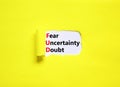 FUD fear uncertainty doubt symbol. Concept words FUD fear uncertainty doubt on white paper on a beautiful yellow background. Royalty Free Stock Photo