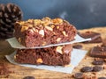 Fudge brownies dark chocolate cake topping with almond slice. Royalty Free Stock Photo